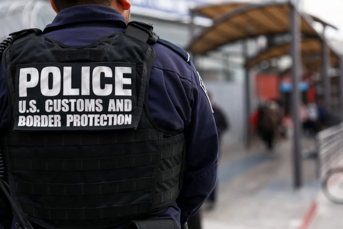 Customs and Border Protection agents check pedestrians as they exit Mexico into the customs area of the United States on the east side of the San Ysidro port of entry in Tijuana, Mexico, on Nov. 19, 2018. (Charlotte Cuthbertson/The Epoch Times)