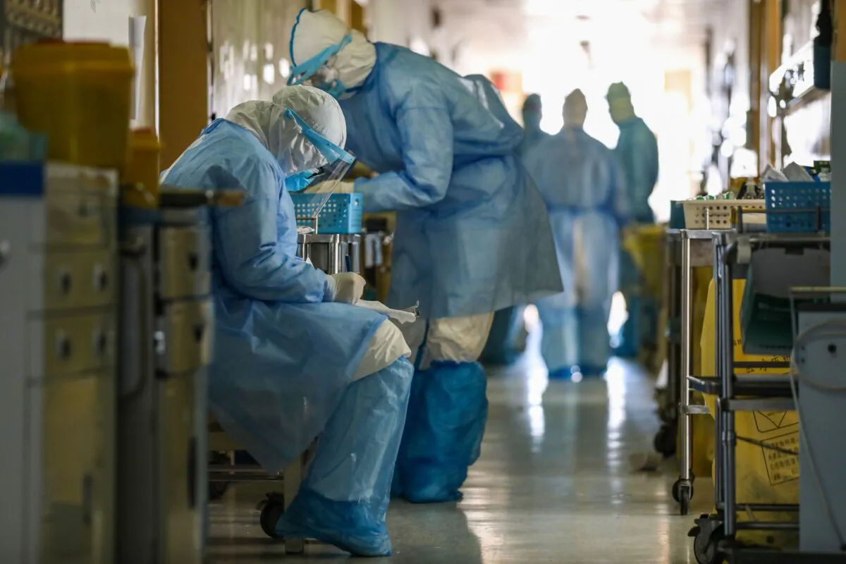 Medical staff members working at the isolation ward of the Wuhan Red Cross Hospital in Wuhan in China's central Hubei Province, on Feb. 16, 2020. (STR/AFP via Getty Images)