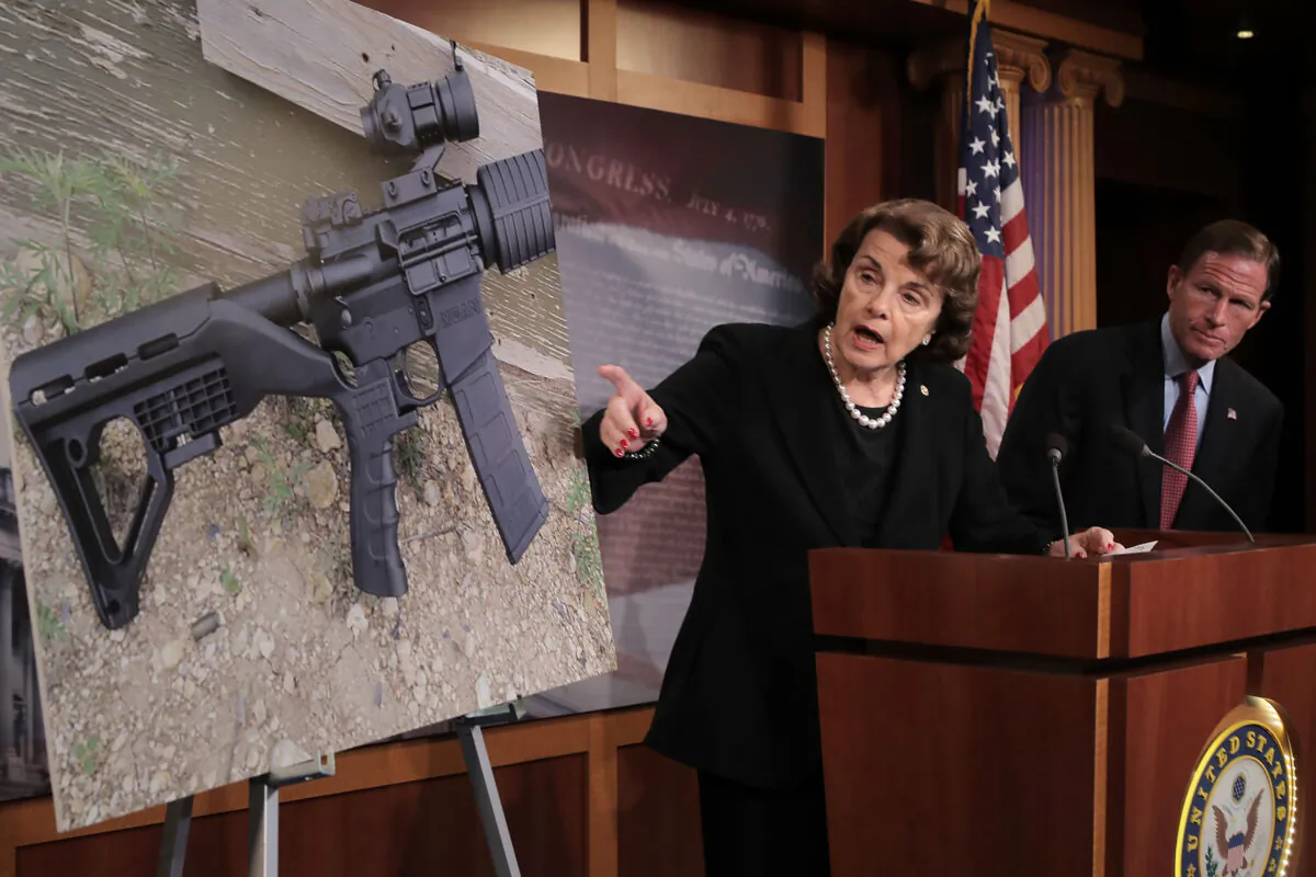 Sen. Dianne Feinstein (D-Calif.) and Sen. Richard Blumenthal (D-Conn.) points to a photograph of a rifle with a "bump stock" during a news conference to announce proposed gun control legislation at the U.S. Capitol in Washington on Oct. 4, 2017. (Chip Somodevilla/Getty Images)