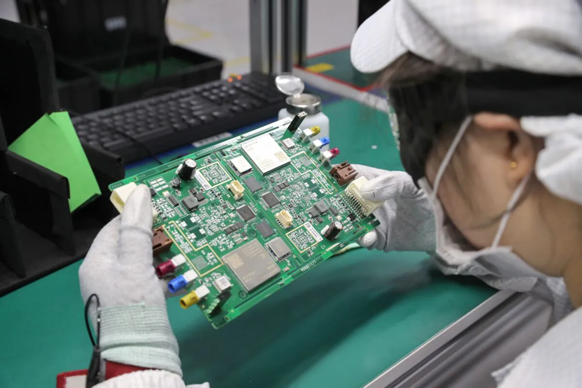 A Chinese employee works at a factory in Nantong in China's eastern Jiangsu province on Feb. 10, 2020. (STR/AFP via Getty Images)