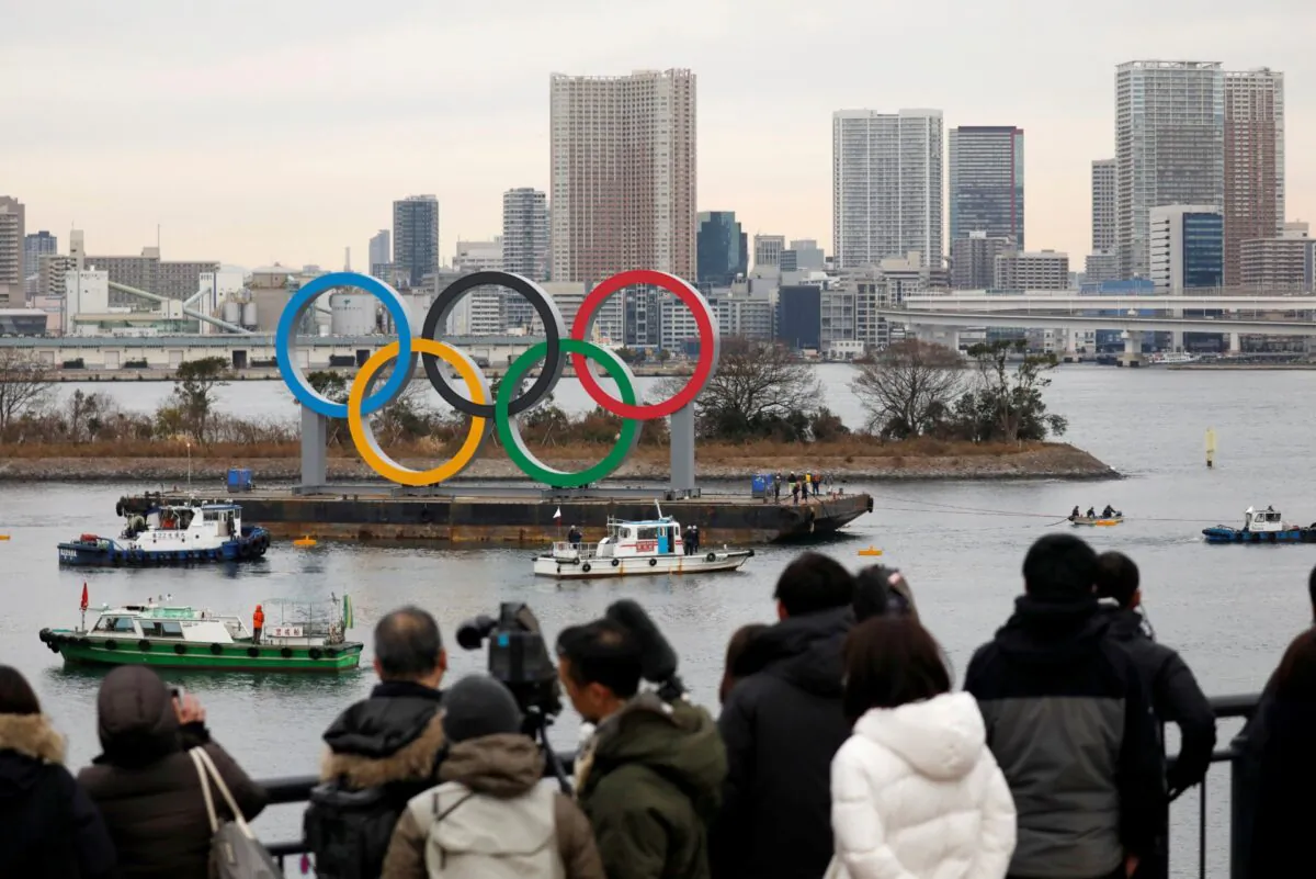 Giant Olympic Rings are installed at the waterfront area, with the Rainbow Bridge in the background at Odaiba Marine Park in Tokyo, Japan, on Jan. 17, 2020. (Issei Kato/Reuters/File Photo)