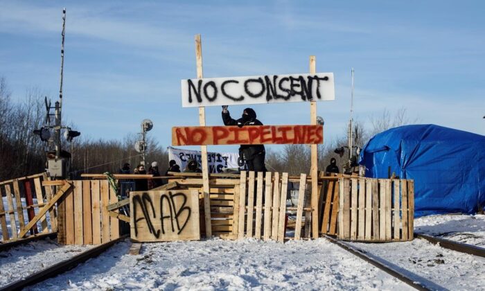 Supporters of the Wet'suwet'en who are against the LNG pipeline, block a CN Rail line just west of Edmonton on Feb. 19, 2020. (Jason Franson/Canadian Press)