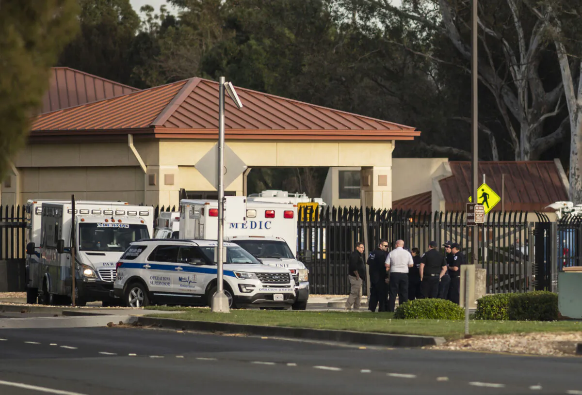 A group of ambulances from the Solano EMS Cooperative stage at the visitor center at Travis Air Force Base, adjacent to Fairfield, Calif. on Feb. 16, 2020. (Hector Amezcua/AP Photo)