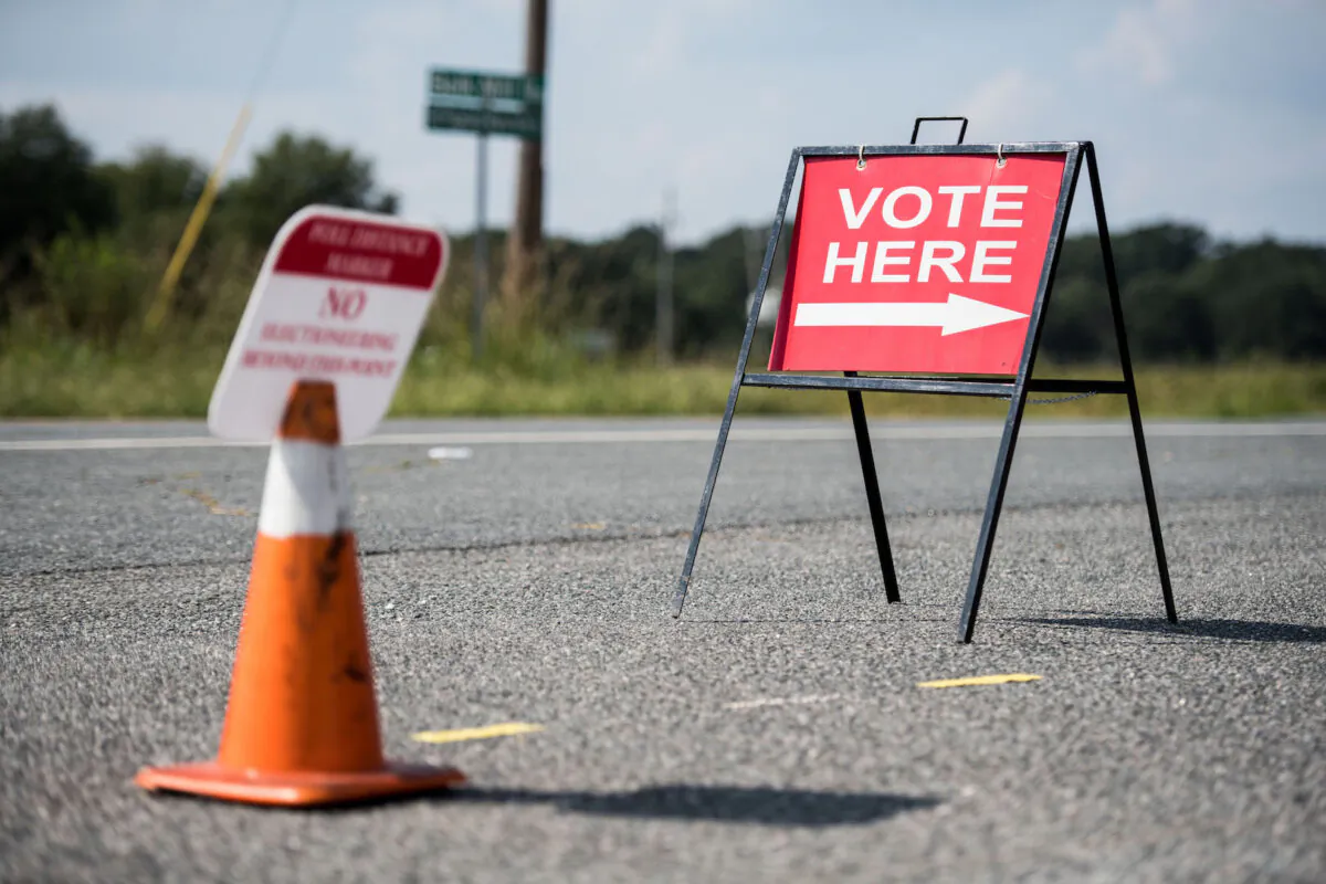 A sign directs voters outside of a polling station during the special election between Democrat Dan McCready and Republican Dan Bishop in North Carolina's 9th Congressional District in Marshville, North Carolina, on Sept. 10, 2019. (Sean Rayford/Getty Images)