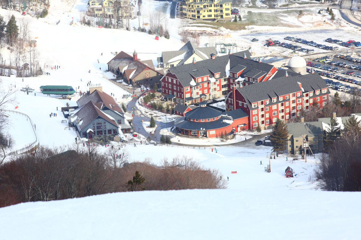 The view of Sugarbush’s main base, Lincoln Peak Village, anchored by the barn-red, luxurious yet unpretentious Claybrook Hotel. (Abby Sessock/ Sugarbush Resort and Alterra Mountain Company)