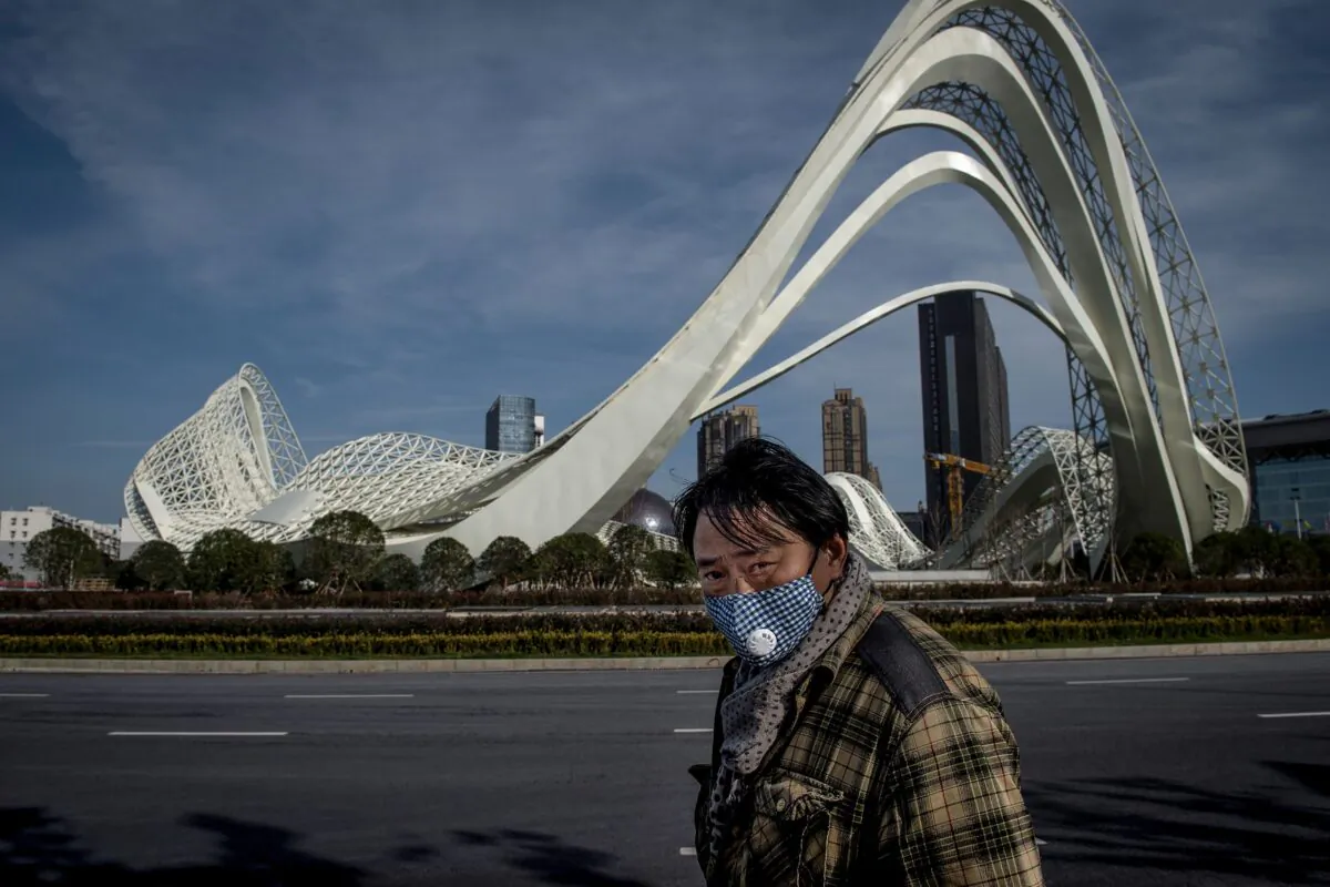 A man is walking on the street in Wuhan on Feb. 17, 2020. (STR/AFP via Getty Images)