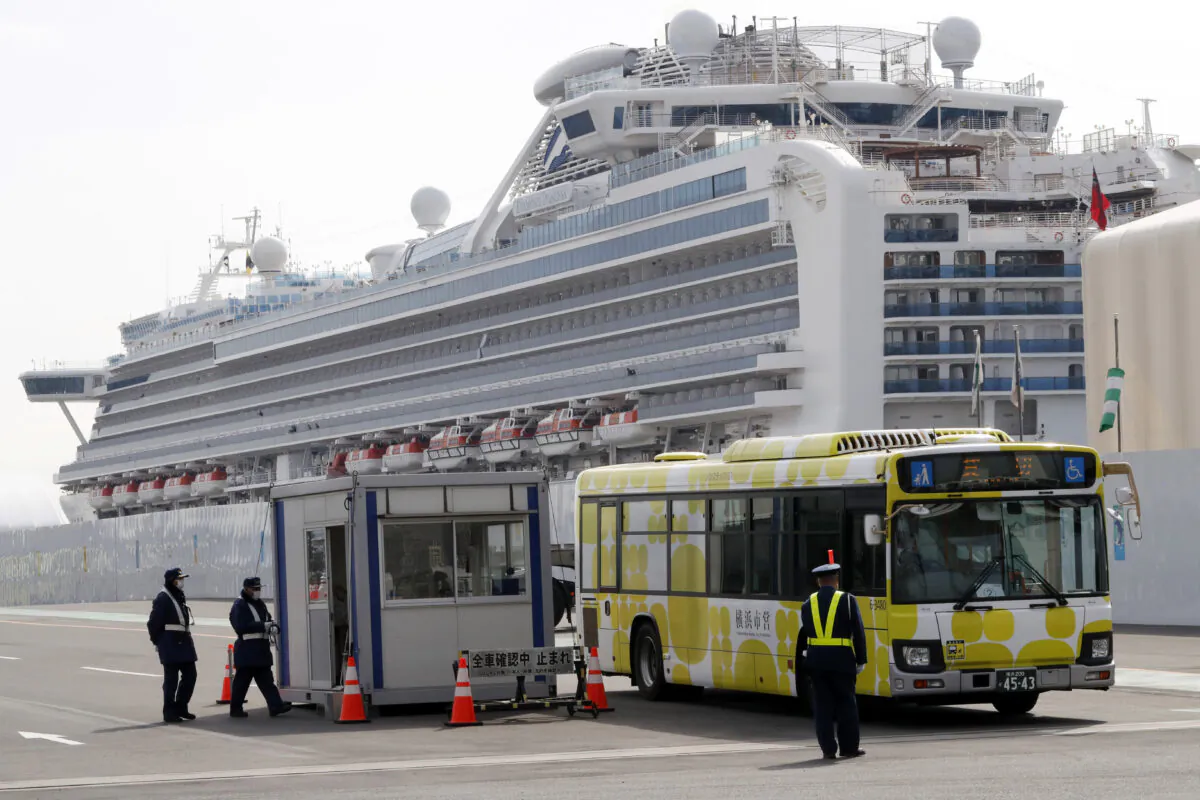 A bus carrying passengers from the quarantined Diamond Princess cruise ship leaves a port in Yokohama, near Tokyo on Feb. 20, 2020. (Eugene Hoshiko/AP Photo)
