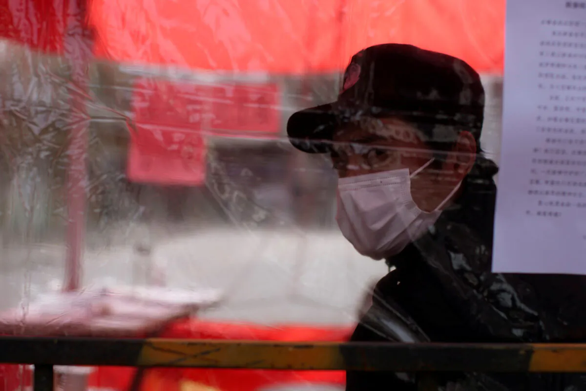 A man wearing face mask is seen in Qibao, an old river town on the outskirts of Shanghai, China, as the country is hit by an outbreak of the novel coronavirus, on Feb. 19, 2020. (Aly Song/Reuters)