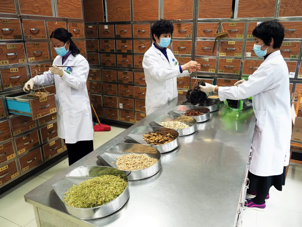 Medical workers prepare traditional Chinese medicine (TCM) at a TCM hospital as the country is hit by an outbreak of the new coronavirus, in Binzhou, Shandong Province, China, on Feb. 5, 2020. (cnsphoto via Reuters)