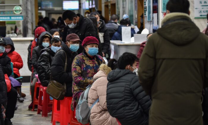 People wearing facemasks as they wait at the Wuhan Red Cross Hospital in Wuhan on Jan. 24, 2020. (Hector Retamal/AFP via Getty Images)