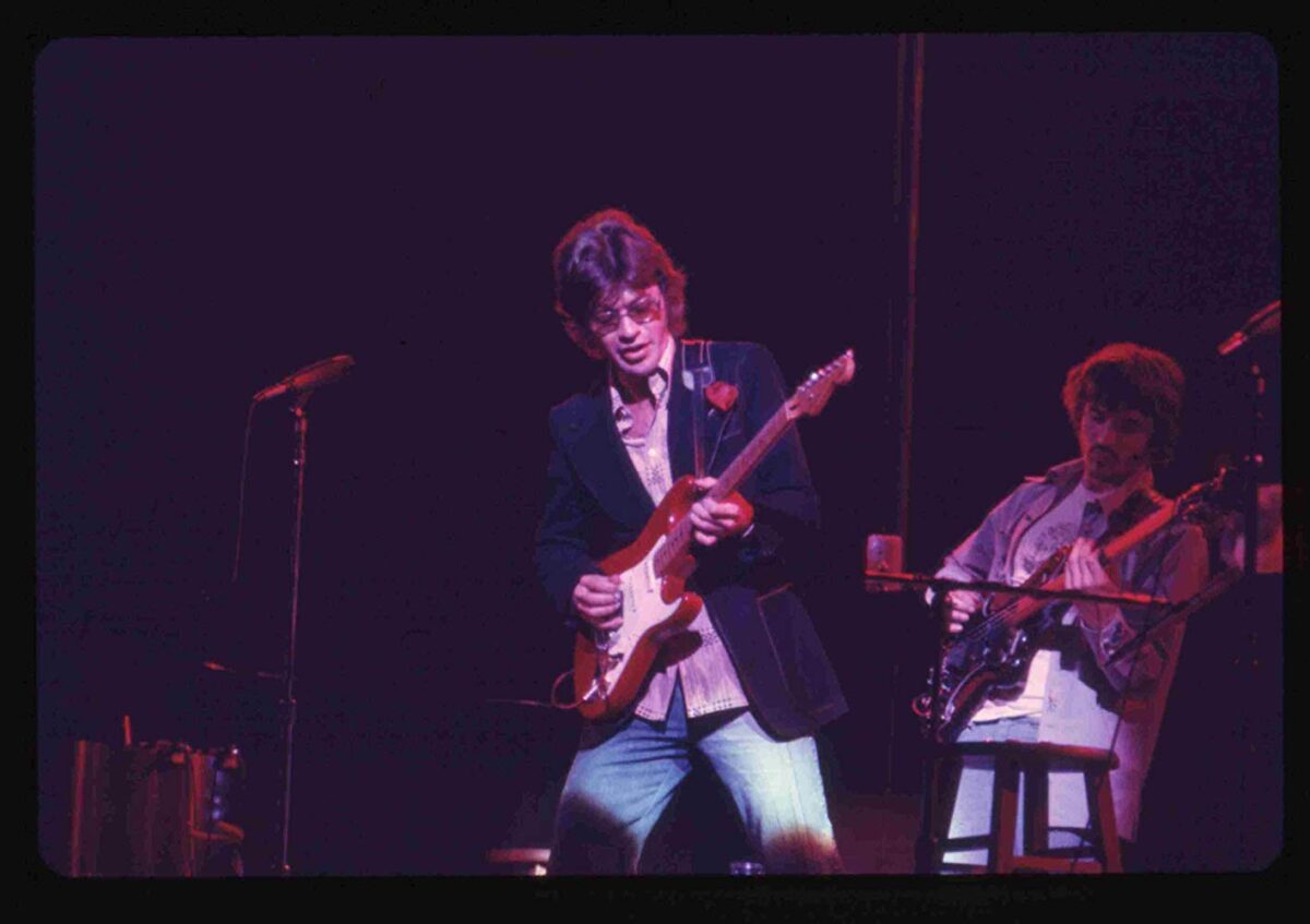 guitarist and bassist onstage in Once Were Brothers: Robbie Robertson and The Band