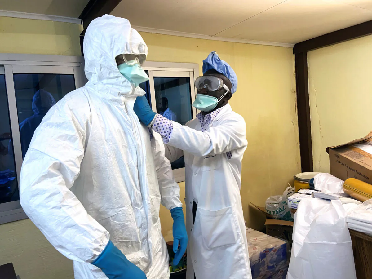 A medical staff wears protective gear at a new section specialized in receiving any person who may have been infected with coronavirus at The Quinquinie Hospital in Douala, Cameroon, on Feb. 17, 2020. (Josiane Kouagheu/Reuters)