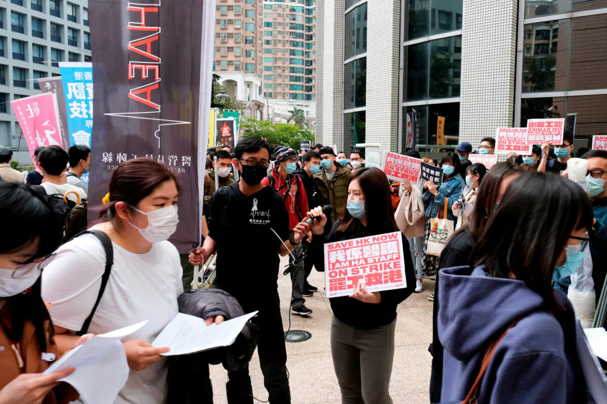 Winnie Yu, chairwoman of the Hospital Authority Employees Alliance (HAEA), speaks during a strike outside the Hospital Authority as they demand for Hong Kong to close its border with China to reduce the coronavirus spreading, in Hong Kong, China on Feb. 4, 2020. (Tyrone Siu/Reuters)