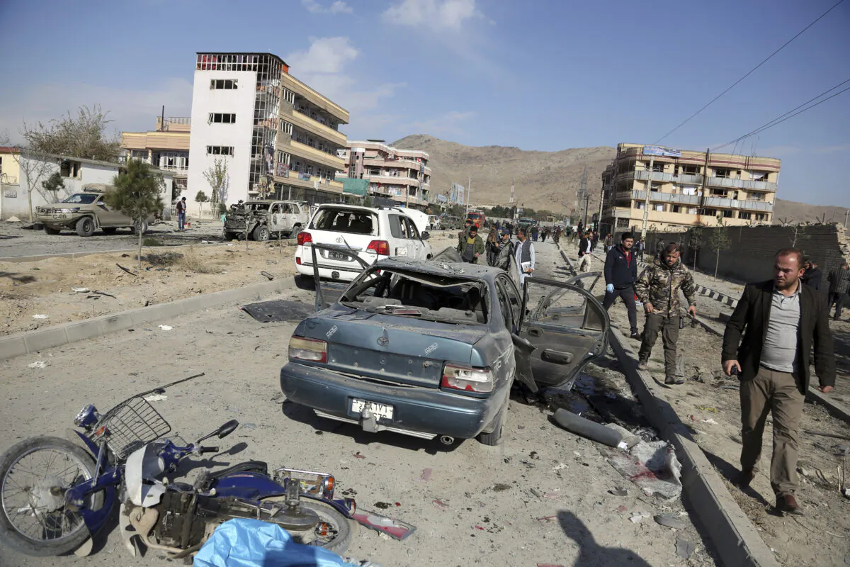 Afghan security personnel gather at the site of a car bomb attack in Kabul, Afghanistan, on Nov. 13, 2019. (Rahmat Gul/file/AP Photo)