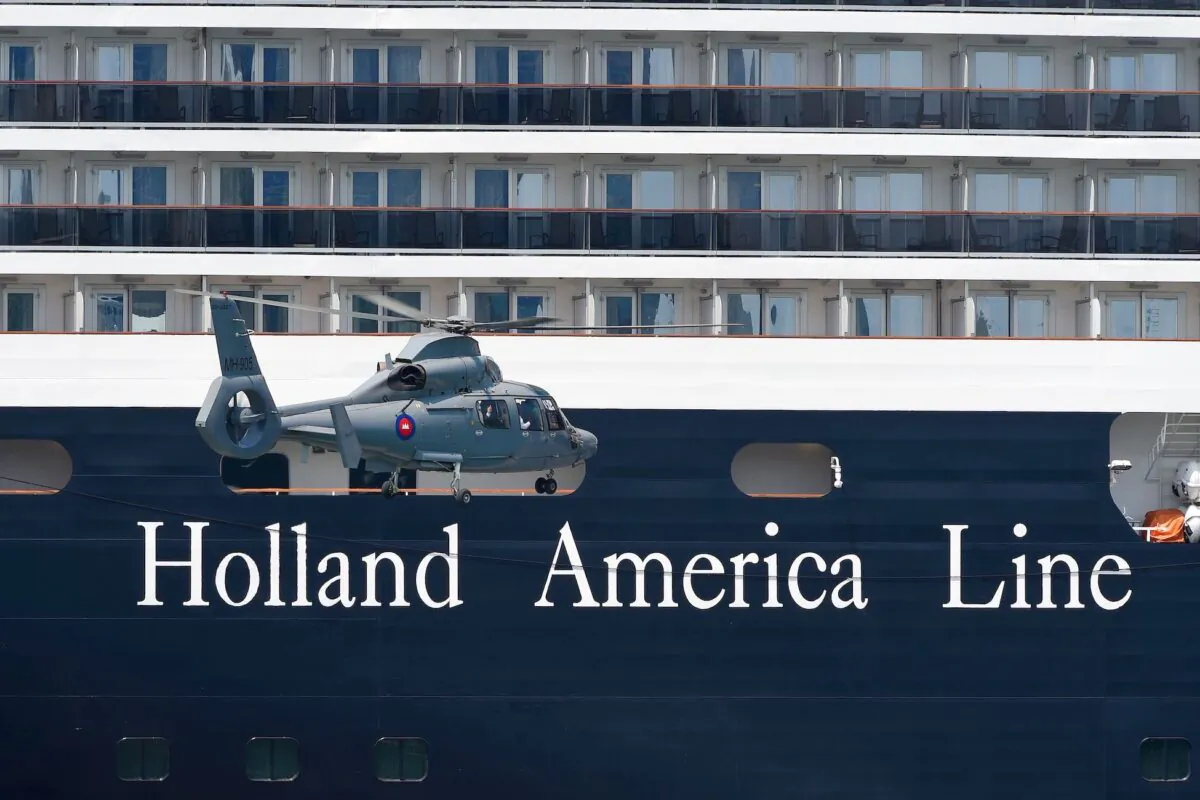 A helicopter prepares to land near the Westerdam cruise ship in Sihanoukville, Cambodia, on Feb. 19, 2020. (Tang Chhin Sothy/AFP via Getty Images)