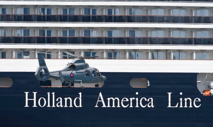 A helicopter prepares to land near the Westerdam cruise ship in Sihanoukville, Cambodia, on Feb. 19, 2020. (Tang Chhin Sothy/AFP via Getty Images)