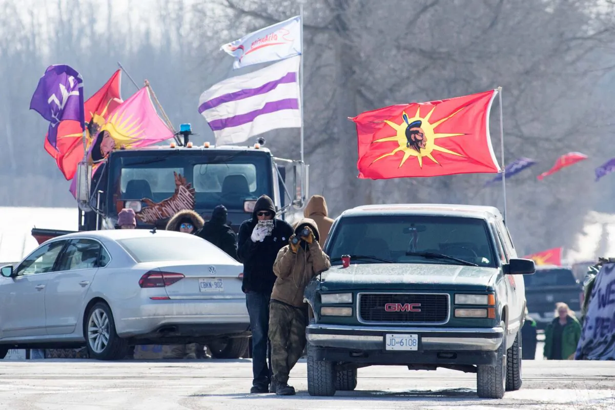 Protesters at a rail blockade in Tyendinaga, near Belleville, Ont., on Feb. 22, 2020, in support of the Wet'suwet'en who oppose work on a pipeline in northern B.C. (The Canadian Press/Lars Hagberg)