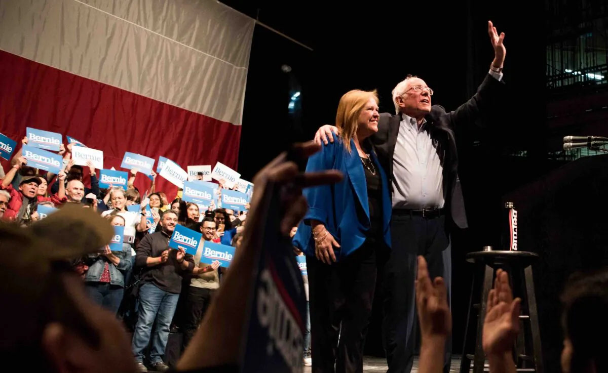 Democratic presidential candidate Sen. Bernie Sanders (I-VT) waves to the crowd alongside his wife, Mary Jane O'Meara Sanders, at a campaign rally in El Paso, Texas, on Feb. 22, 2020. (Cengiz Yar/Getty Images)