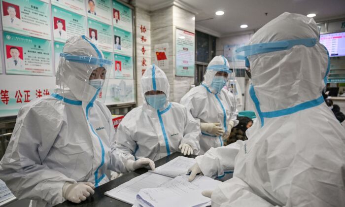 Medical staff members work at the Wuhan Red Cross Hospital in Wuhan, China, on Jan. 25, 2020. (HECTOR RETAMAL/AFP via Getty Images)