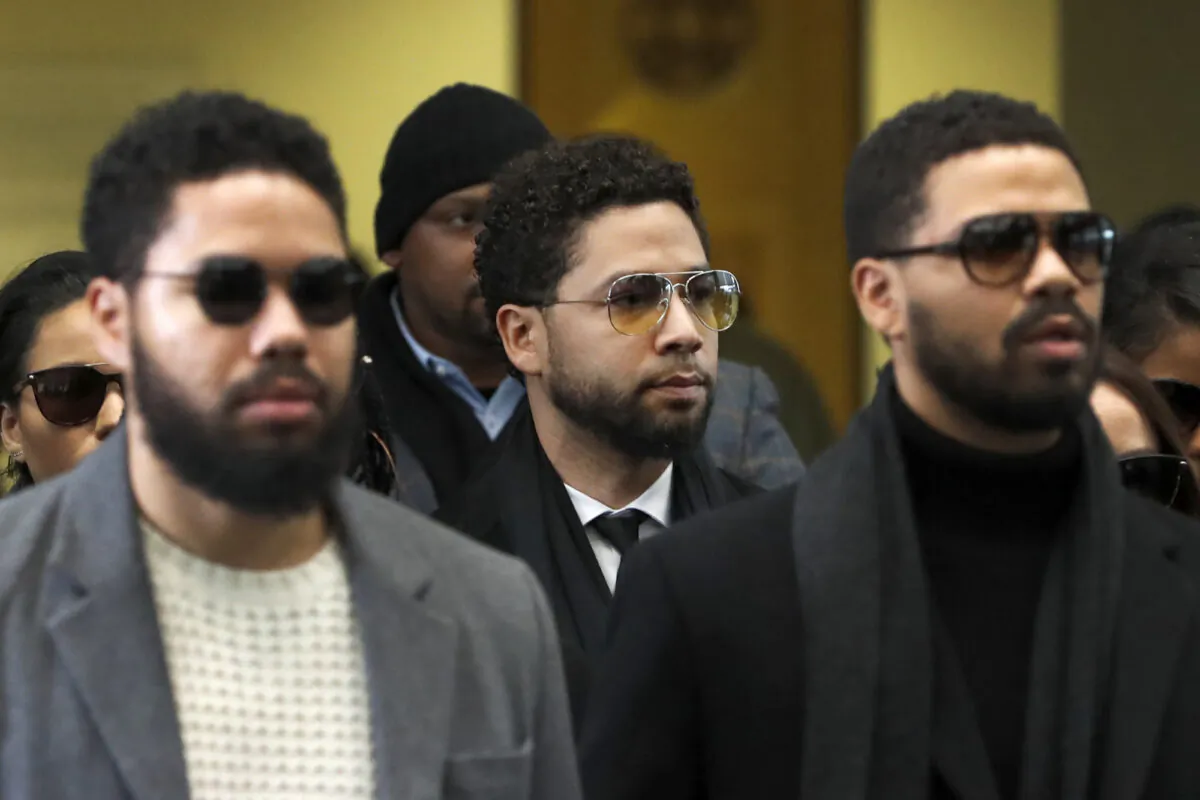 Actor Jussie Smollett, center, departs after an initial court appearance at the Leighton Criminal Courthouse, in Chicago, on Feb. 24, 2020. (Charles Rex Arbogast/AP Photo)