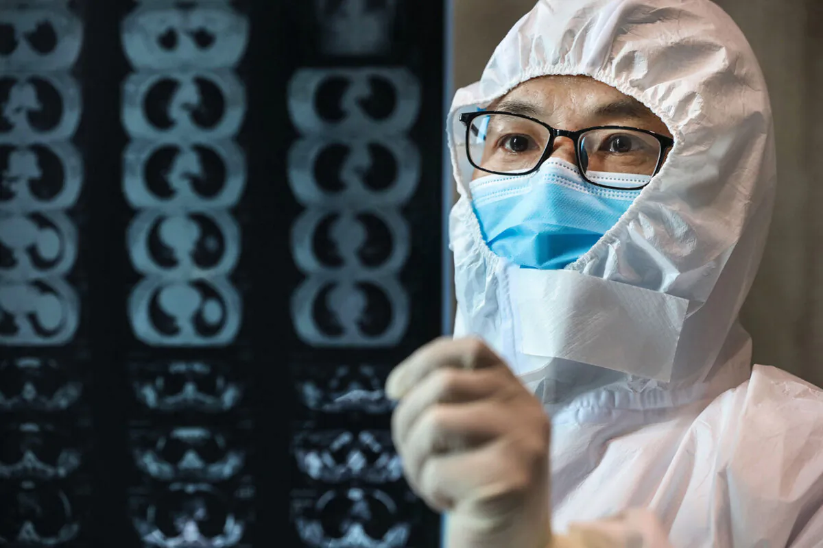 A doctor looks at a lung CT image at a hospital in Yunmeng county, Xiaogan city, in China's central Hubei province, on Feb. 20, 2020. (STR/AFP via Getty Images)