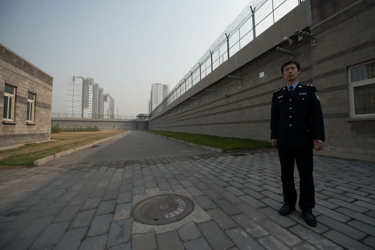 A prison guard stands in a courtyard inside the No. 1 Detention Center in Beijing on Oct. 25, 2012. (Ed Jones/AFP via Getty Images)