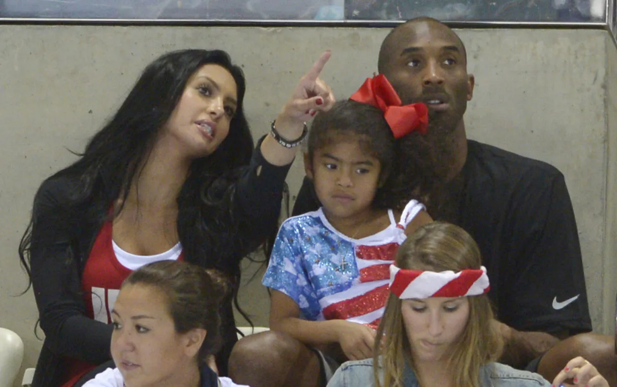 Kobe Bryant with his wife Vanessa and daughter Gianna prepare to watch the final night of swimming at the Aquatics Centre in the Olympic Park during the 2012 Summer Olympics in London on Aug. 4, 2012. (Mark J. Terrill/AP Photo/File)
