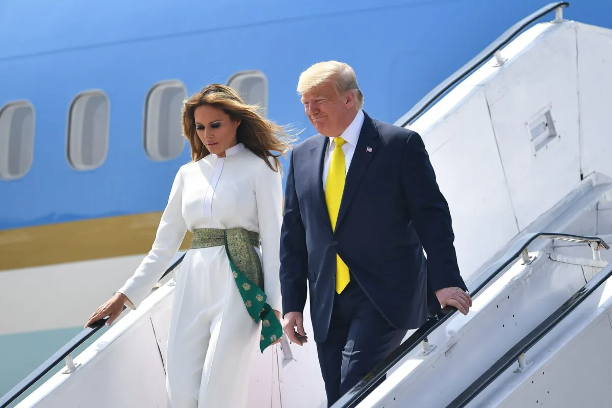 U.S. President Donald Trump and First Lady Melania Trump disembark from Air Force One at Sardar Vallabhbhai Patel International Airport in Ahmedabad, India, on Feb. 24, 2020. (Mandel Ngan/AFP via Getty Images)