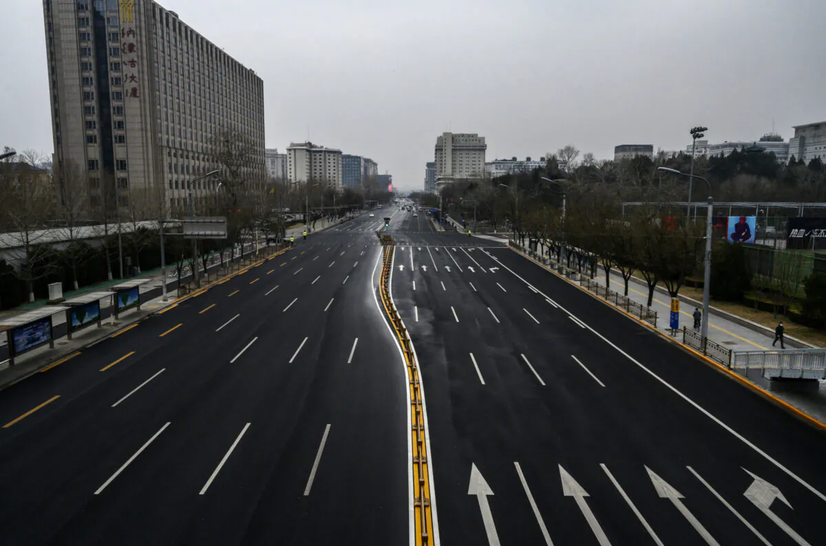 A road is seen much less busy than usual in Beijing, China, on Feb. 24, 2020. (Kevin Frayer/Getty Images)