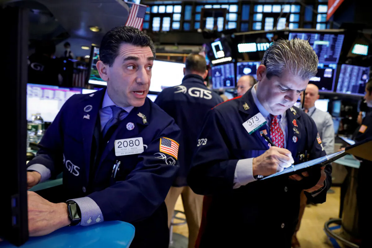 Traders work on the floor at the New York Stock Exchange in New York, on Jan. 21, 2020. (Reuters/Brendan McDermid)