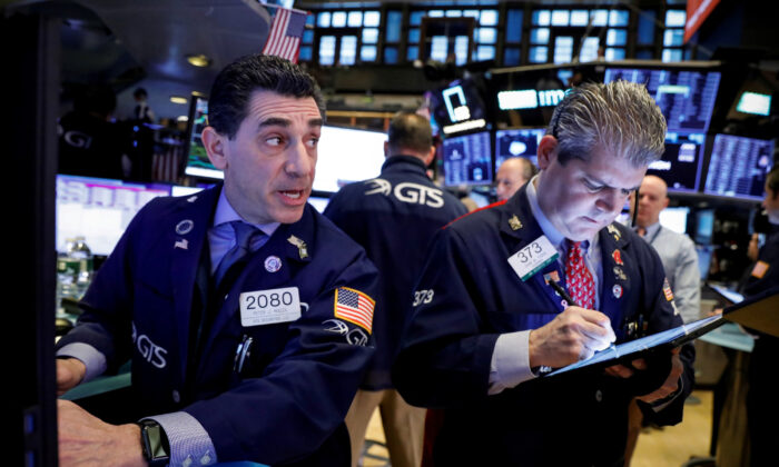 Traders work on the floor at the New York Stock Exchange in New York, on Jan. 21, 2020. (Reuters/Brendan McDermid)