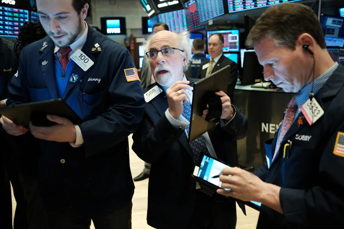 Traders work on the floor of the New York stock Exchange (NYSE) in New York City, on Feb. 24, 2020. (pencer Platt/Getty Images)