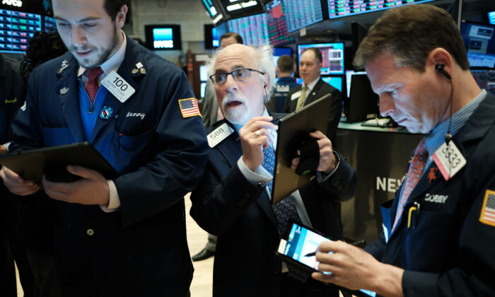 Traders work on the floor of the New York stock Exchange (NYSE) in New York City, on Feb. 24, 2020. (pencer Platt/Getty Images)