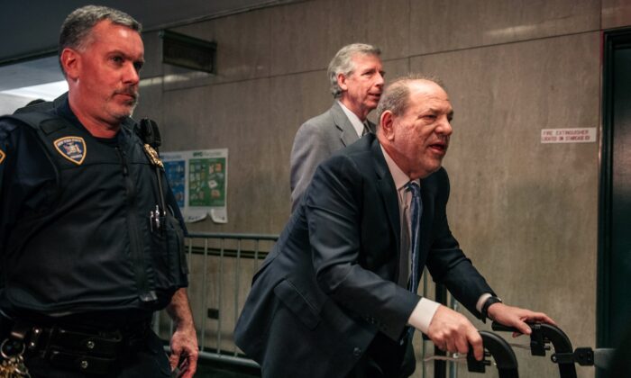 Movie producer Harvey Weinstein (R) enters New York City Criminal Court on Feb. 24, 2020. (Scott Heins/Getty Images)