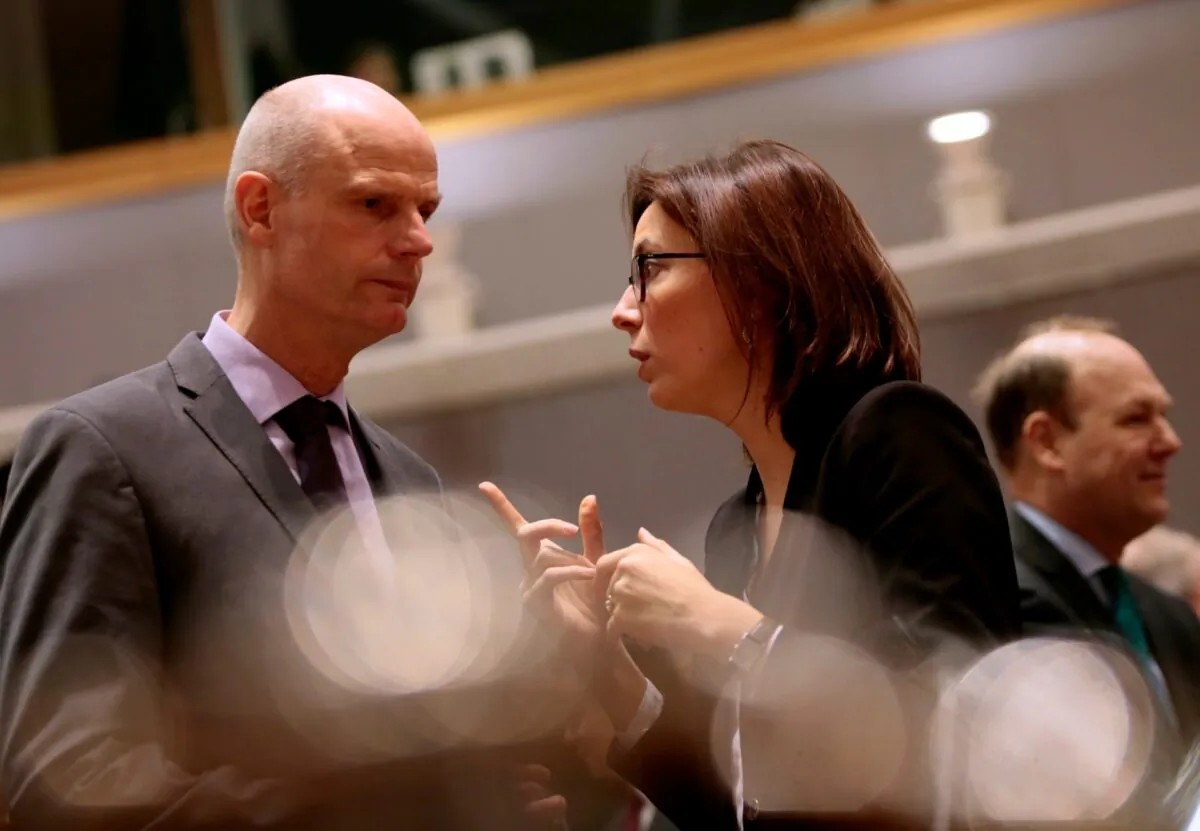 French Junior Minister for European Affairs Amelie de Montchalin (R) speaks with Dutch Foreign Minister Stef Blok during a meeting of EU General Affairs ministers at the European Council building in Brussels, Belgium, on Feb. 25, 2020. (Virginia Mayo/AP Photo)