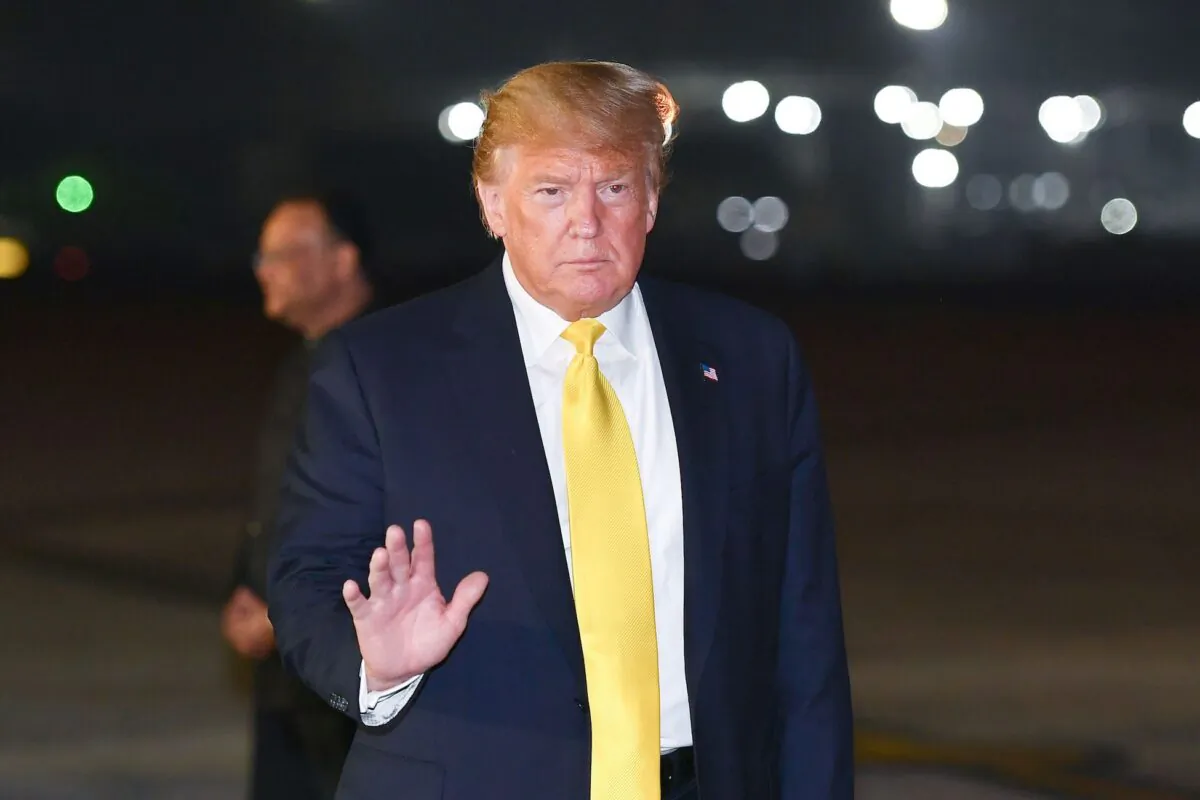 US President Donald Trump waves upon arrival at Palam Air Force Base in New Delhi on Feb. 24, 2020. (Mandel Ngan/AFP via Getty Images)