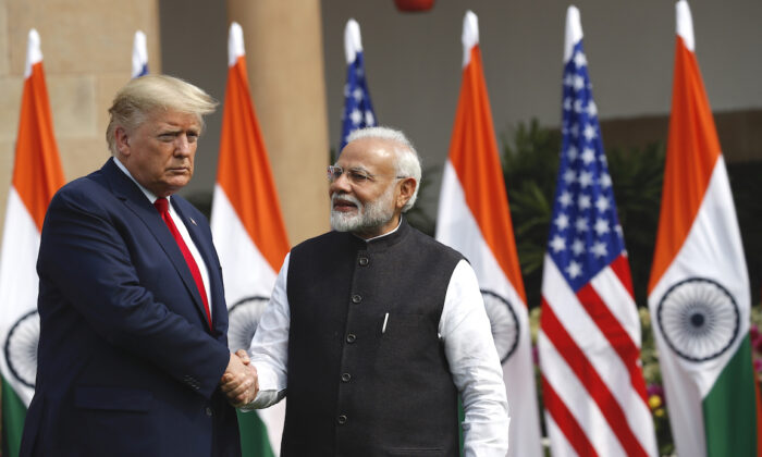 President Trump and Indian Prime Minister Narendra Modi shake hands before their meeting at Hyderabad House in New Delhi, India, on Feb. 25, 2020. (AP Photo/Alex Brandon)
