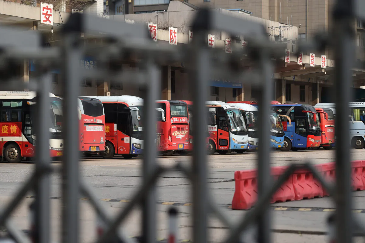 Buses are seen at a closed bus terminal in Wuhan, the epicentre of the novel coronavirus outbreak, Hubei province, China, on Feb. 24, 2020. (Stringer/Reuters)