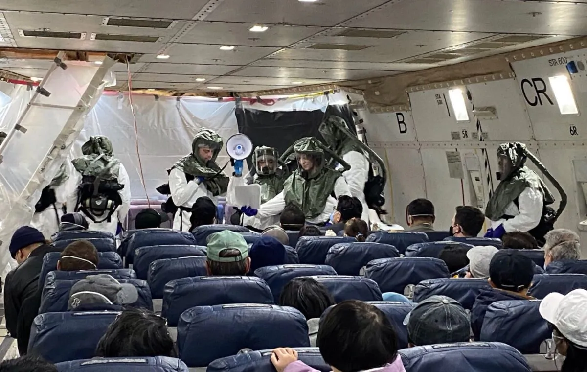 David and his peers on the evacuation plane waiting to go back to the United States at Wuhan Tianhe Airport in Wuhan, China, on Feb. 5, 2020. (Provided to The Epoch Times by David)