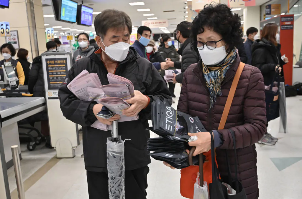 People buy face masks at a retail store in Daegu, South Korea, on Feb. 25, 2020. (Jung Yeon-je/AFP via Getty Images)