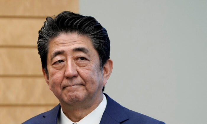 Japanese Prime Minister Shinzo Abe listens to IAEA Director General Rafael Grossi at the prime minister's official residence in Tokyo, Japan, on Feb. 25, 2020. (Kimimasa Mayama/Pool via Reuters)