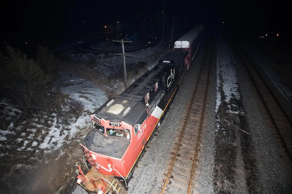 A CN train travels through Tyendinaga, near Belleville, Ont., on Feb. 24, 2020, after police removed the blockade in support of Wet'suwet'en Nation hereditary chiefs attempting to halt construction of a natural gas pipeline on their traditional territories in northern B.C. (Lars Hagberg/The Canadian Press)