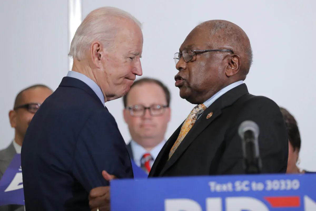 Rep. James Clyburn (D-S.C.) greets Joe Biden at the National Action Network South Carolina Ministers' Breakfast in North Charleston, S.C., on Feb. 26, 2020. (Gerald Herbert/AP Photo)