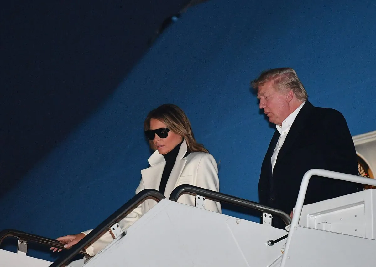 President Donald Trump and First Lady Melania Trump step off Air Force One upon arrival at Andrews Air Force Base in Maryland on Feb. 26, 2020. Trump returned to Washington after a two-day official visit to India. (Mandel Ngan/AFP via Getty Images)