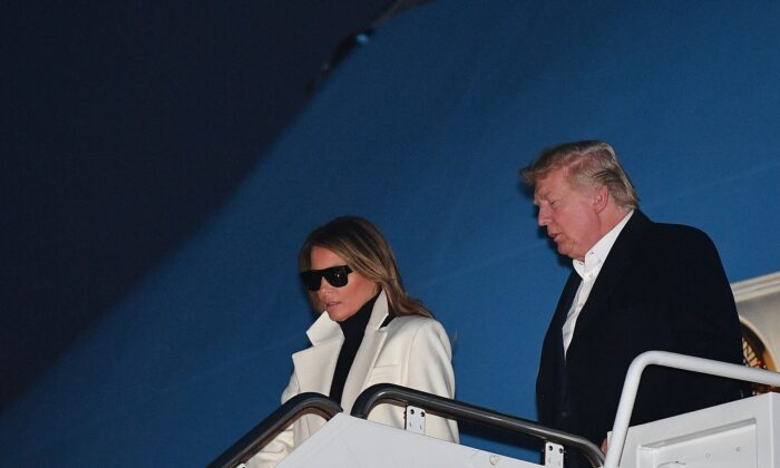 President Donald Trump and First Lady Melania Trump step off Air Force One upon arrival at Andrews Air Force Base in Maryland on Feb. 26, 2020. Trump returned to Washington after a two-day official visit to India. (Mandel Ngan/AFP via Getty Images)