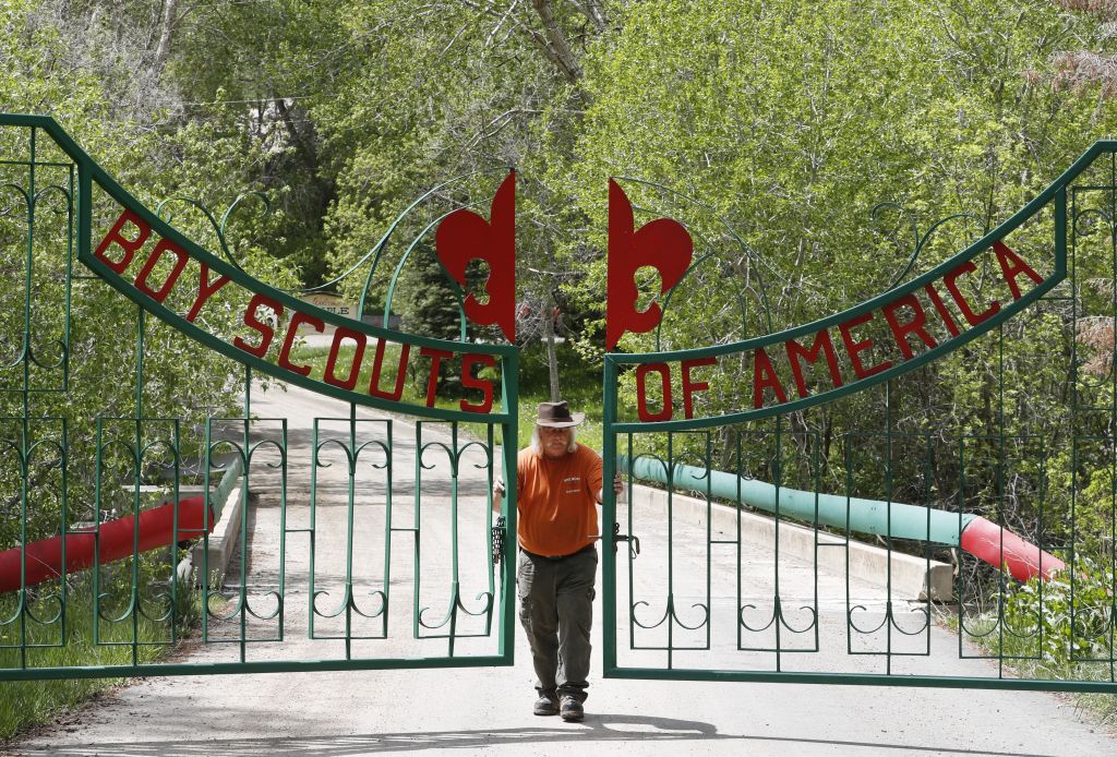 Mark Veteto, camp ranger for the Maple Dell Scout Camp, owned by the Utah National Parks Council of the Boy Scouts of America, closes the front gate for the day on May 9, 2018 outside Payson, Utah. (George Frey/Getty Images)