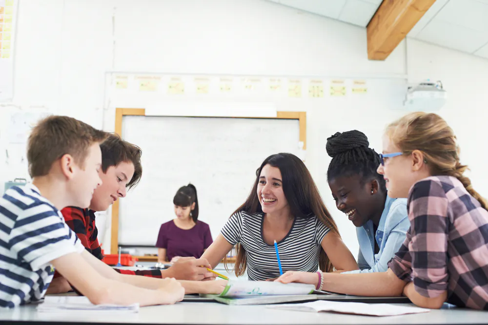 Kids aren’t assigned to public schools by zip code—instead, parents have the ability to put their kids in school anywhere, to buy the educational experience best suited to each child. (SpeedKingz/Shutterstock)