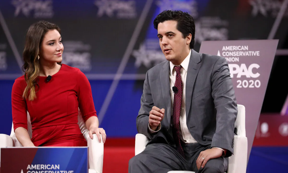 Joshua Philipp, senior reporter at The Epoch Times, and Morgan Zegers of Young Americans Against Socialism speak at the CPAC convention in National Harbor, Md., on Feb. 28, 2020. (Samira Bouaou/The Epoch Times).