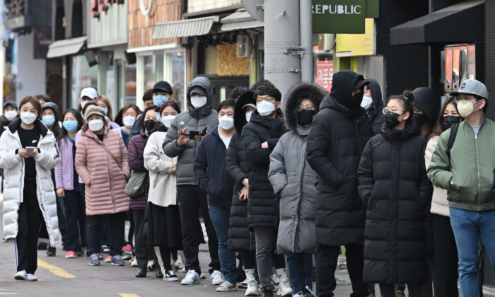 People wait in line to buy face masks from a store at the Dongseongro shopping district in Daegu, South Korea, on Feb. 27, 2020. (Jung Yeon-je/AFP via Getty Images)