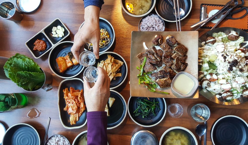 In South Korean drinking culture, soju is at the center of social gatherings and business meetings alike. (Yeongsik Im/Shutterstock)